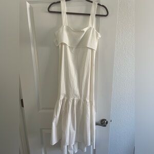 White midi dress with bow tie in the back.